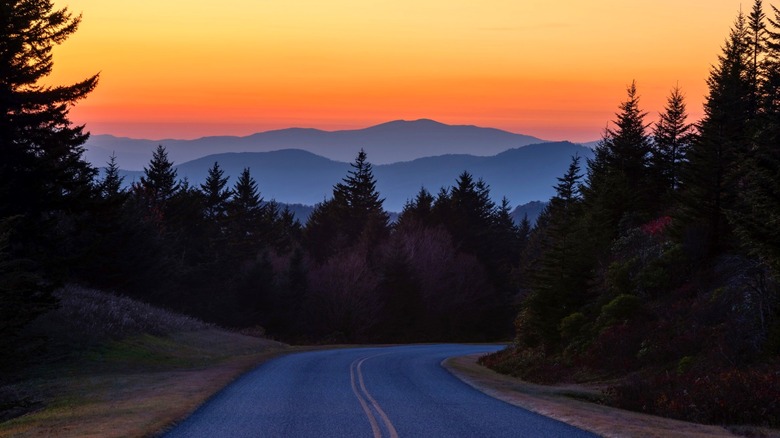 Sun setting in mountains  