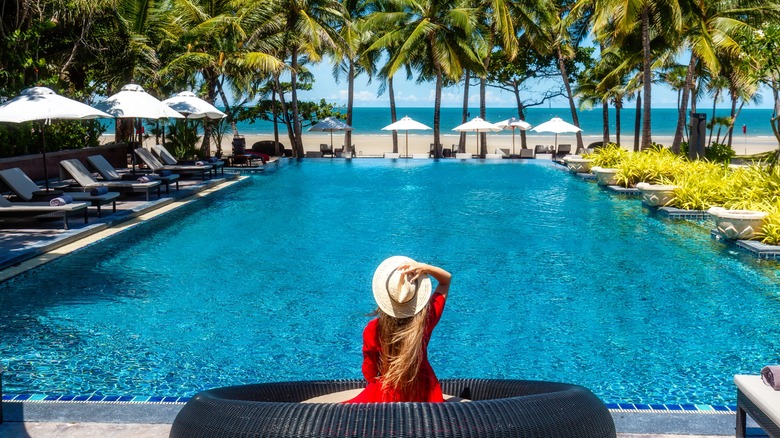 Woman relaxes by a pool