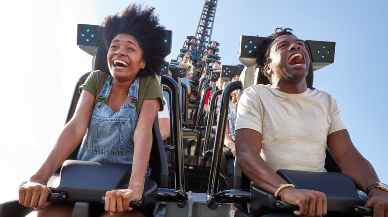 Riders screaming on Jurassic World VelociCoaster