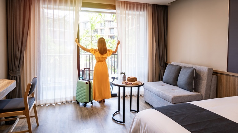 Woman in hotel room