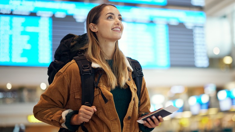 female traveler looking for gate