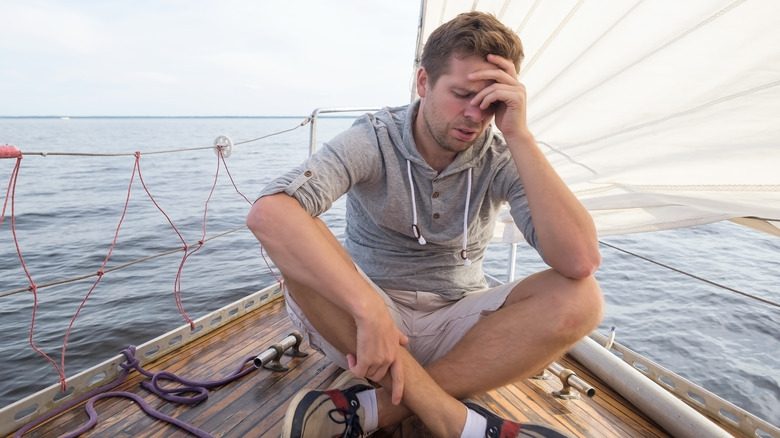 Man seasick on boat