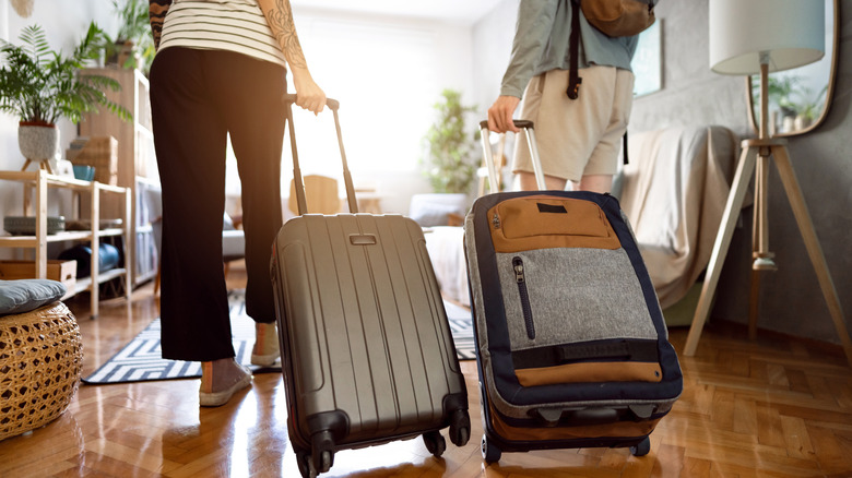 couple with suitcases