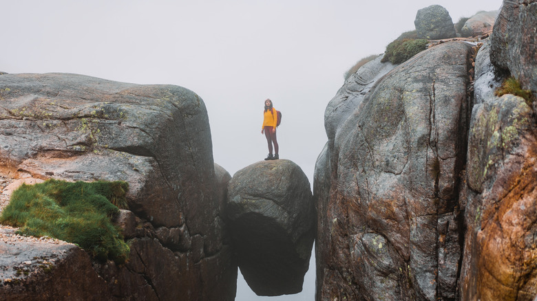 Person standing on boulder