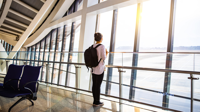 A person at the airport in the morning