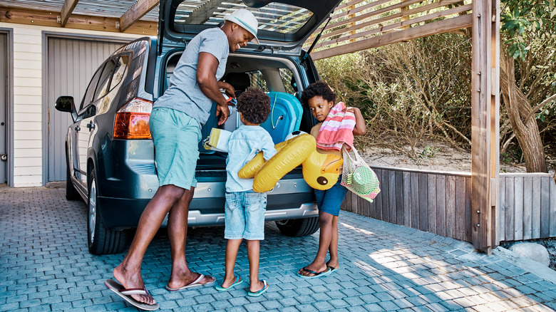 family preparing for road trip