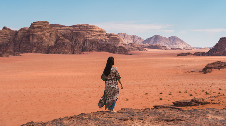 Traveler hiking through Wadi Rum