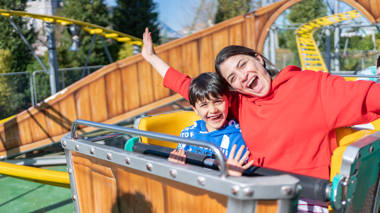 mom and son riding rollercoaster