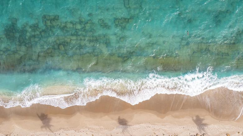 Turquoise water lapping the beach