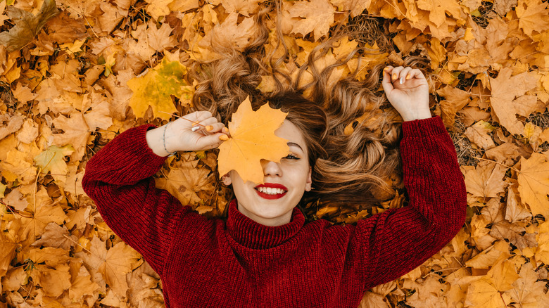 Woman holding leaf