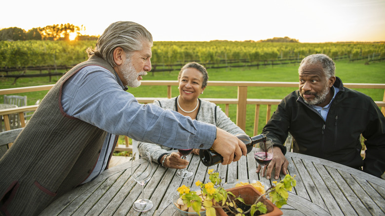 People drinking wine