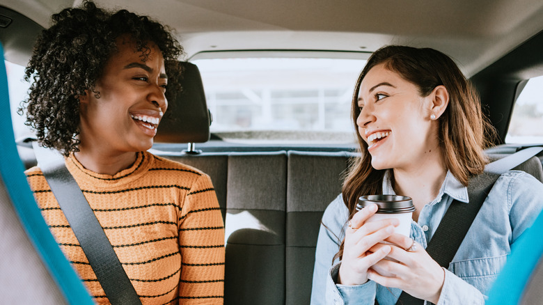 women in car backseat