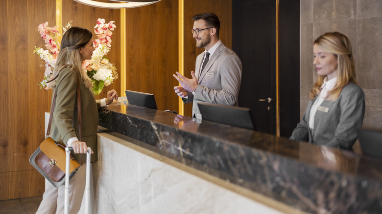 woman checking into hotel