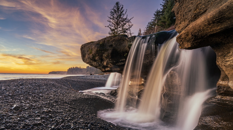 Rocky coastline, waterfalls, sunset