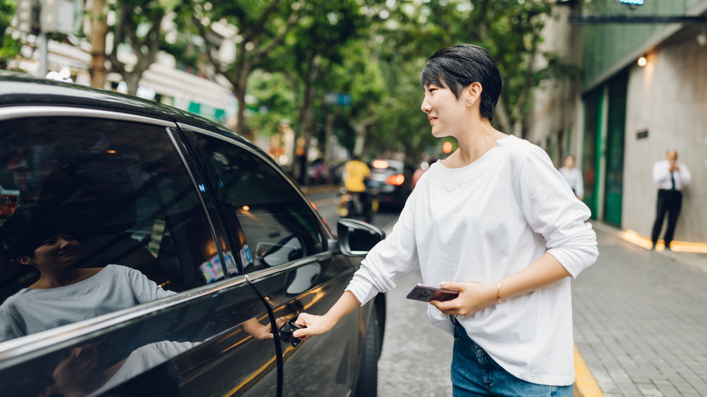 Woman getting into an Uber