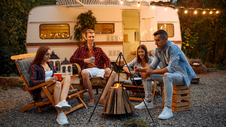 Friends sitting around a campfire