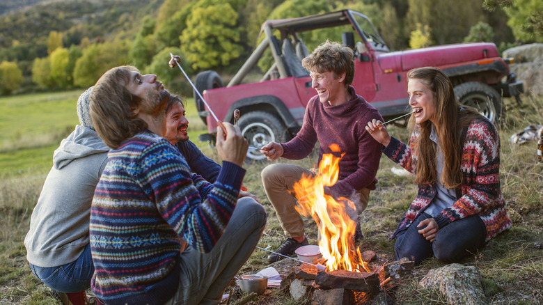 Family camping at dusk