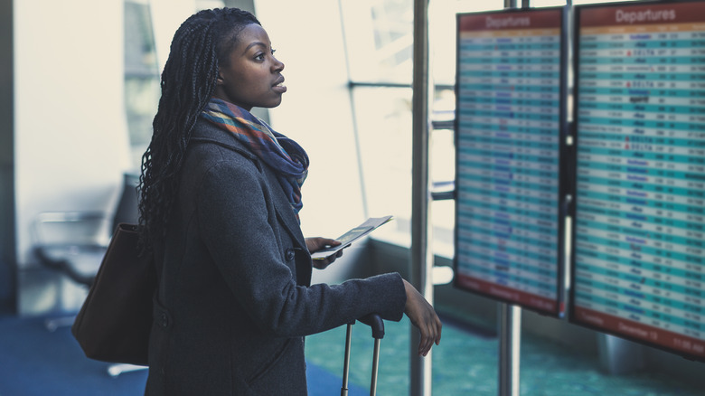 Woman looking at flight table