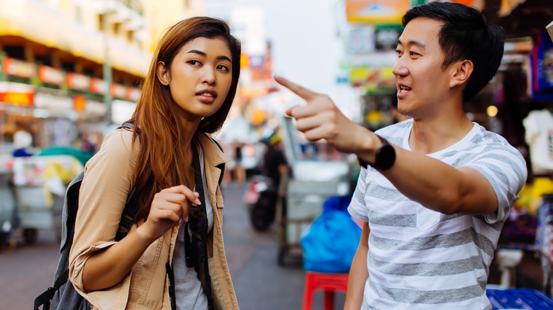 tourist talking to local