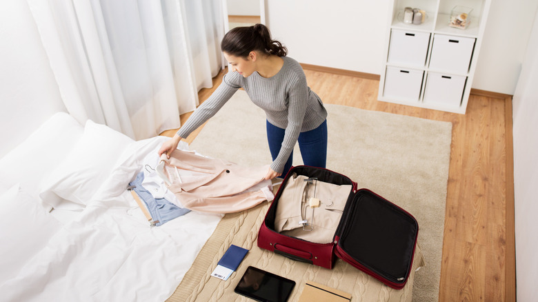 woman packing carry-on