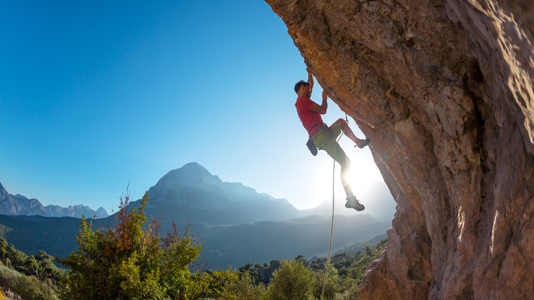 Rock climber scaling a cliff