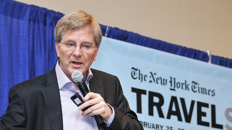 Rick Steves speaking on stage