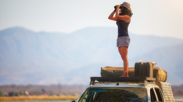 woman on car in Africa