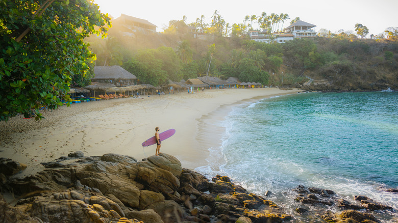 man with surfboard in Mexico