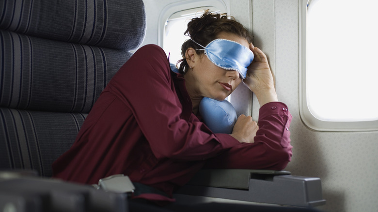 Woman sleeping on a plane