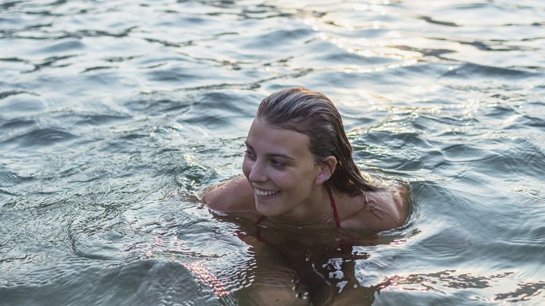 Woman swimming in lake