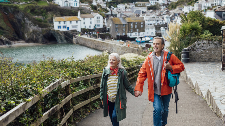 couple holding hands on vacation