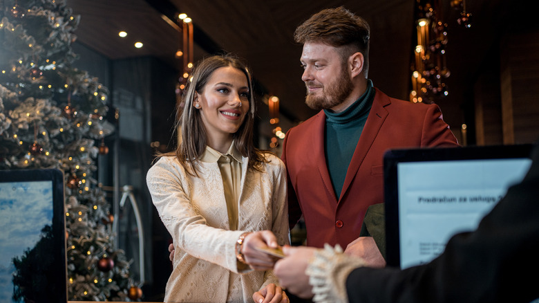 Couple checking in at hotel