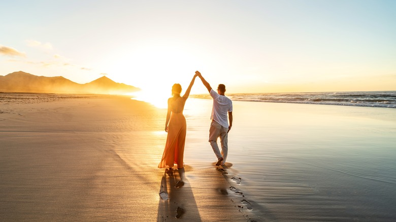 Couple walking on beach