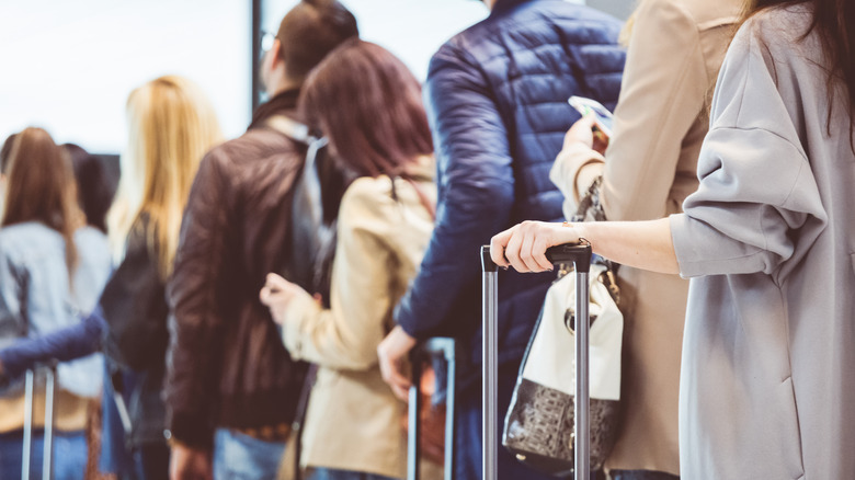 Passengers lining up at airport