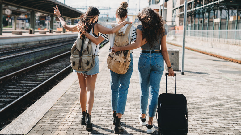 travelers at train station