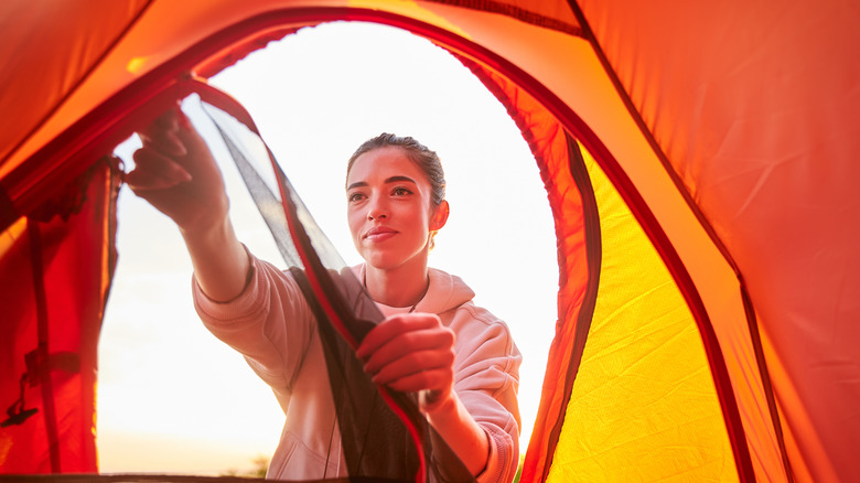 Woman zips tent