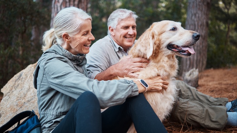 Couple hiking with dog